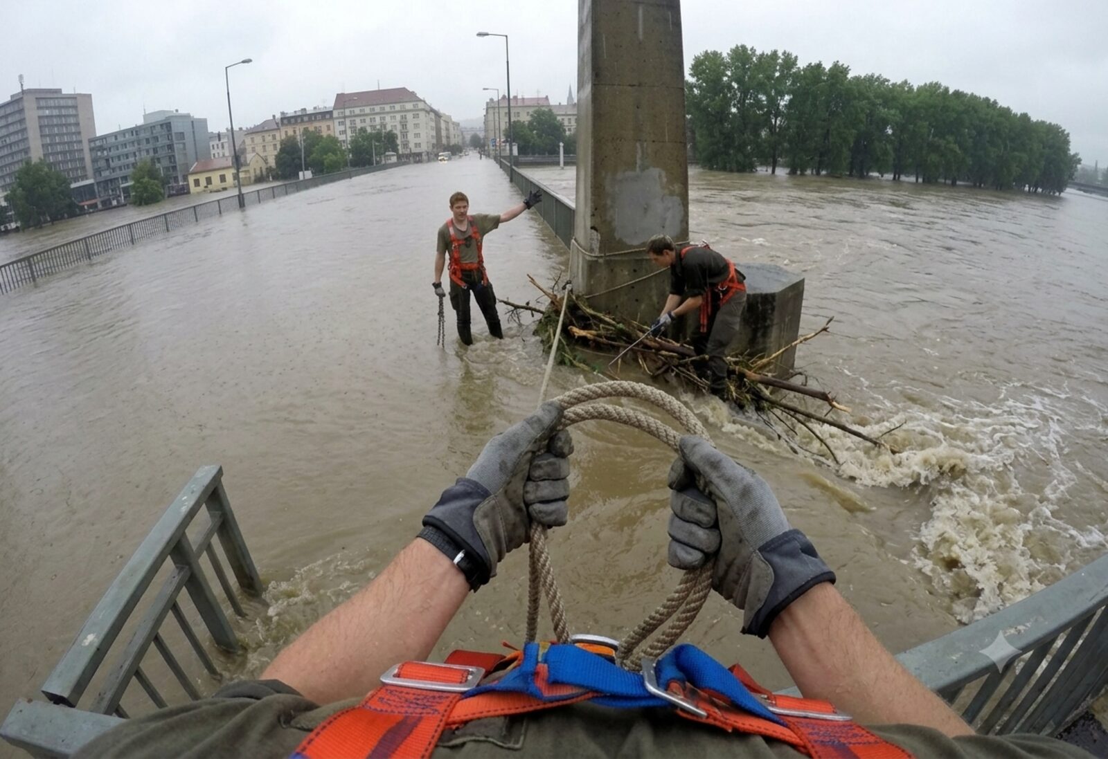 Evacuation during a flood, secured with rope and harness